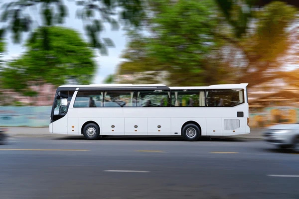 white-tourist-bus-on-highway-600nw-2647639717